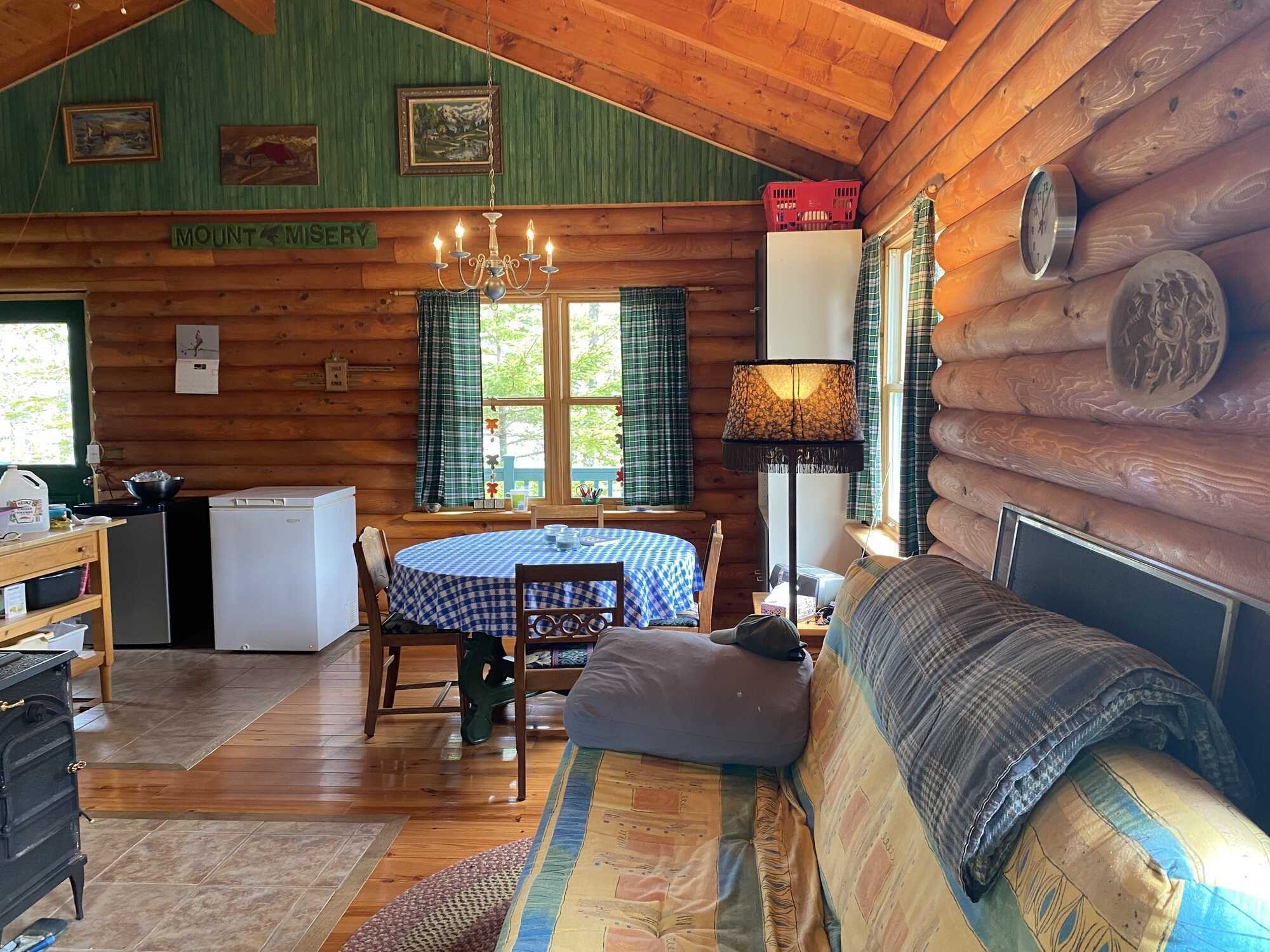 Log home in a quiet location! Lots of opportunity with more land available to purchase! 3