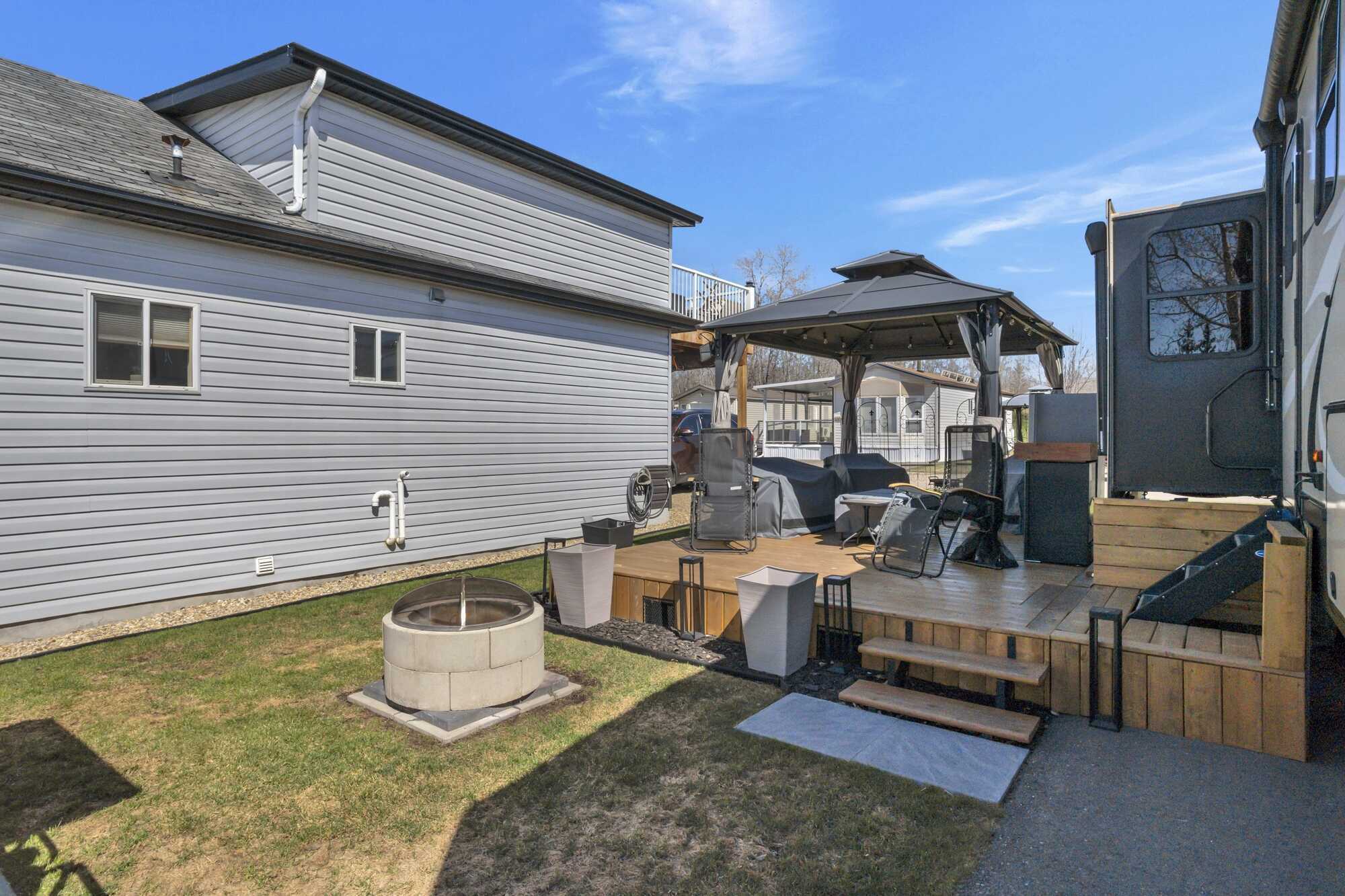 IMMEDIATE POSSESSION! PRICE REDUCED! Lake life at one of Alberta's most sought-after lakes & golf communities!This lake lot includes a 2019 Keystone Cougar 5th wheel Trailer & more ~ Whispering Pines Golf and Country Club Resort ~ 18 Hole Golf Course 4
