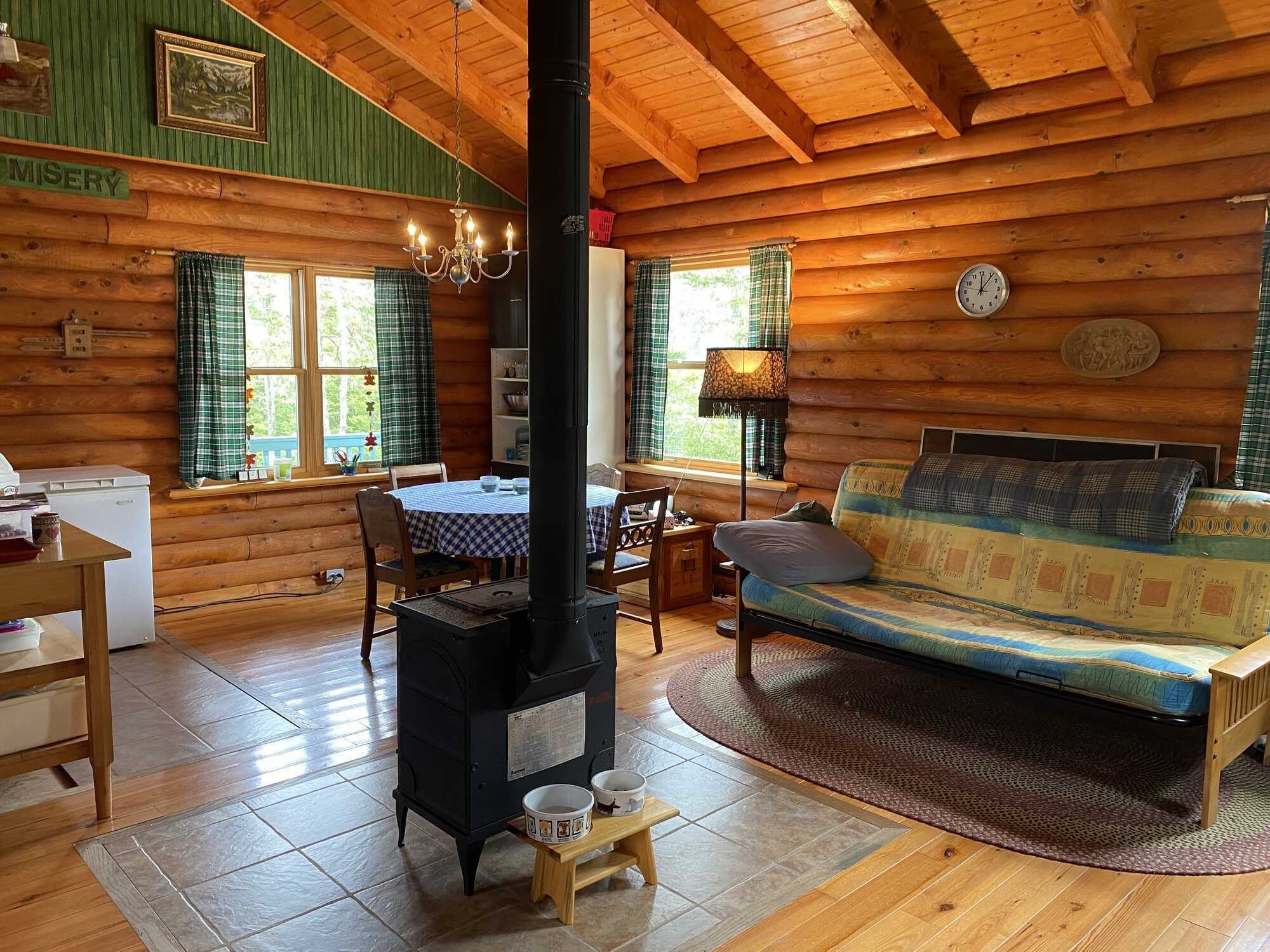 Log home in a quiet location! Lots of opportunity with more land available to purchase! 4
