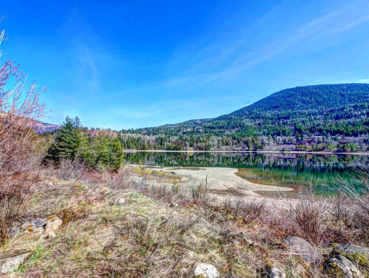 FIRST TIME ON THE MARKET!! Over 12 Acres of land across from the shores of the Kootenay River! 4