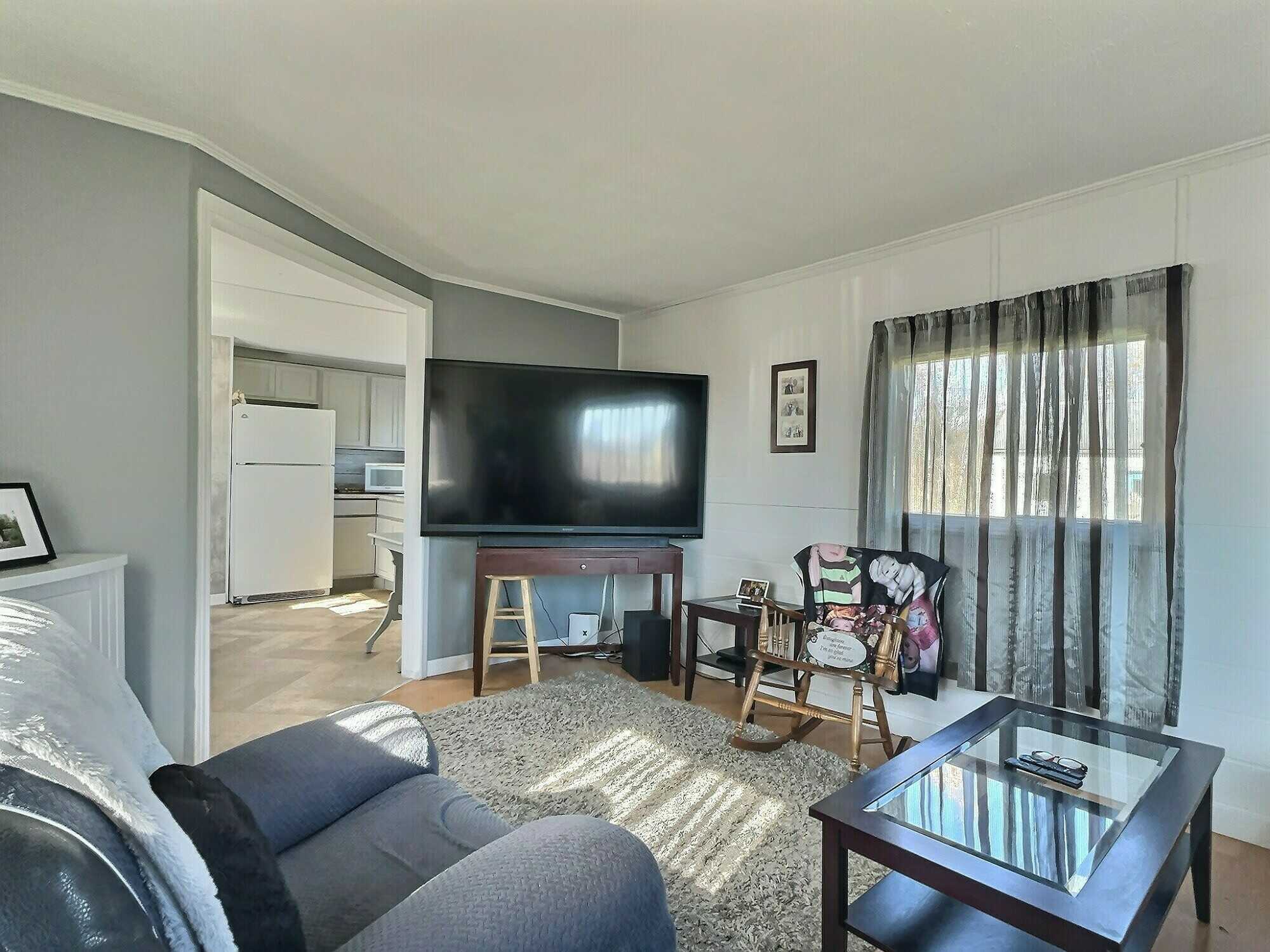 Attention first-time home buyers or downsizers! This move-in-ready two-bedroom mini home offers affordable comfort on a beautifully landscaped 0.71-acre lot. 3