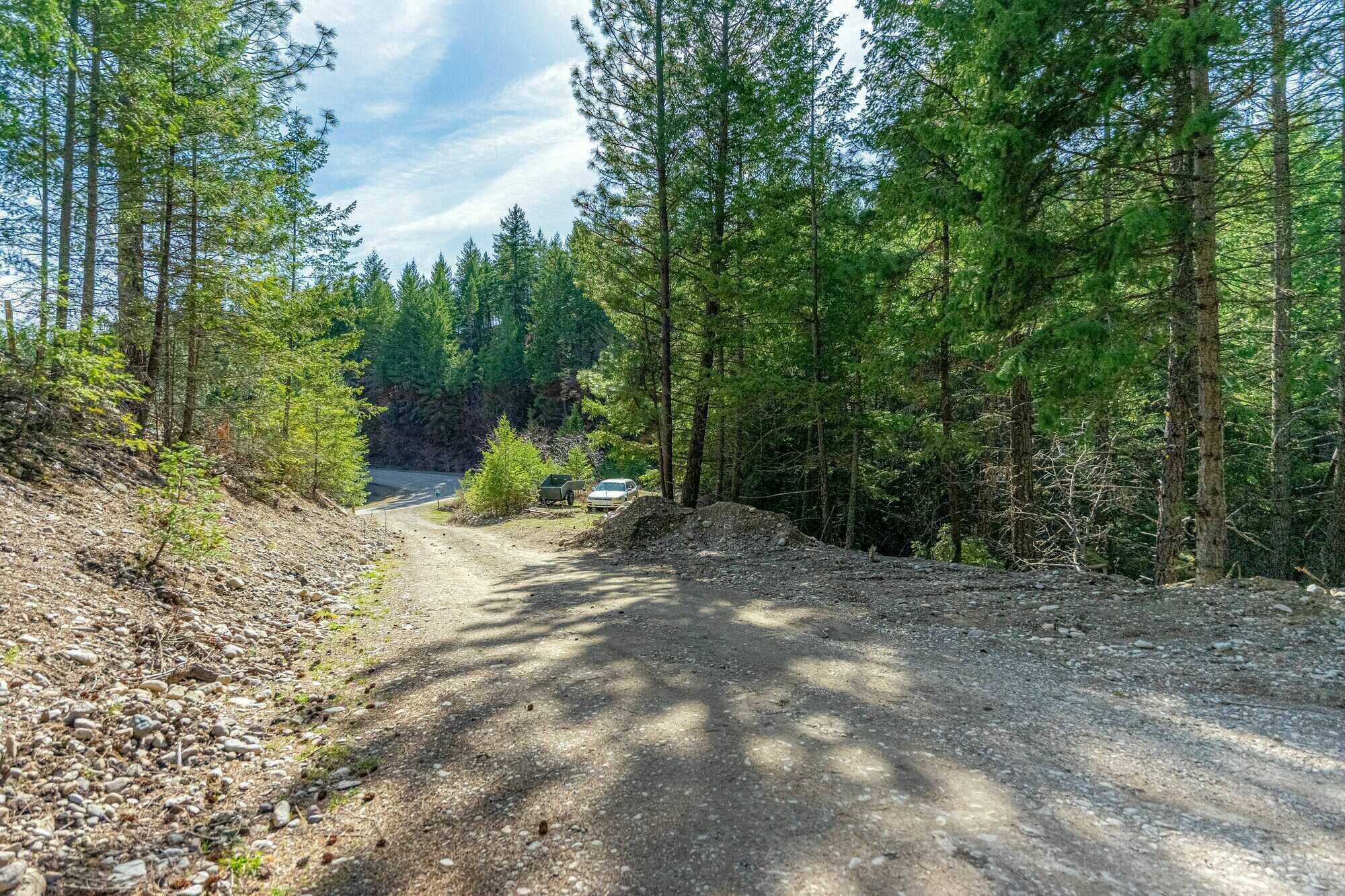 Beautiful, Open, Flat 2 acre lot in the heart of the Okanagan! Stones throw to the beach and backs onto crown land! 5
