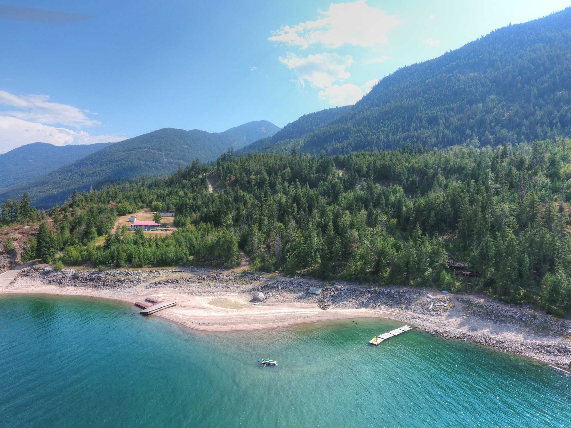 WATERFRONT off-grid cabin on 6.46 acres with an incredible 246 feet of beach! Right on Arrow Lake, 33km from Castlegar across from Deer Park. Peaceful & private property of your dreams - you won't find another anything like it in this price range! 3