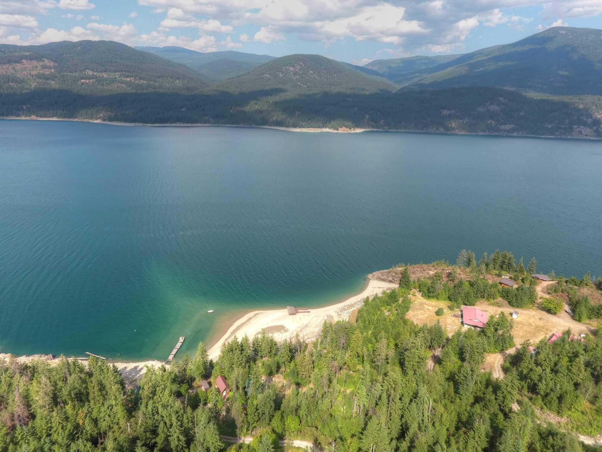 WATERFRONT off-grid cabin on 6.46 acres with an incredible 246 feet of beach! Right on Arrow Lake, 33km from Castlegar across from Deer Park. Peaceful & private property of your dreams - you won't find another anything like it in this price range! 5