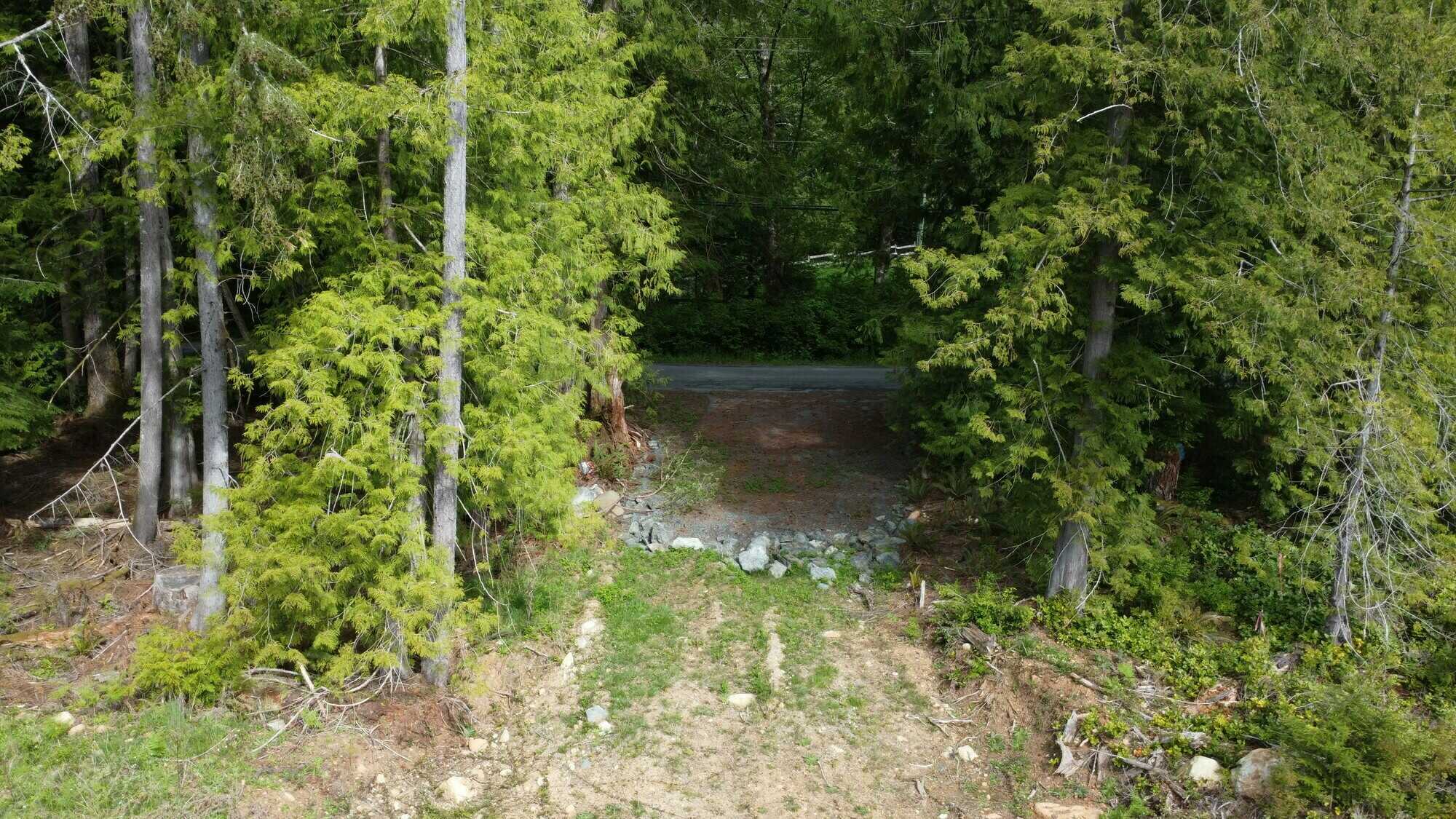 Spacious buildable area for your dream home on 2.47ac lot.  Just minutes from Sooke, this rural setting provides the benefits of space and privacy in a natural setting.  On-site well, level building area, zoned RR2. Call 250-919-7126 for info. 4