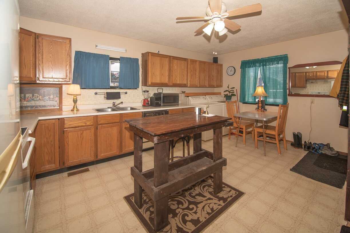 Awsome 2 bedroom RANCHER home on a large corner lot! Very nicely maintained on a fully fenced property with screened in porch, and a powered 10x10 shop/shed 2
