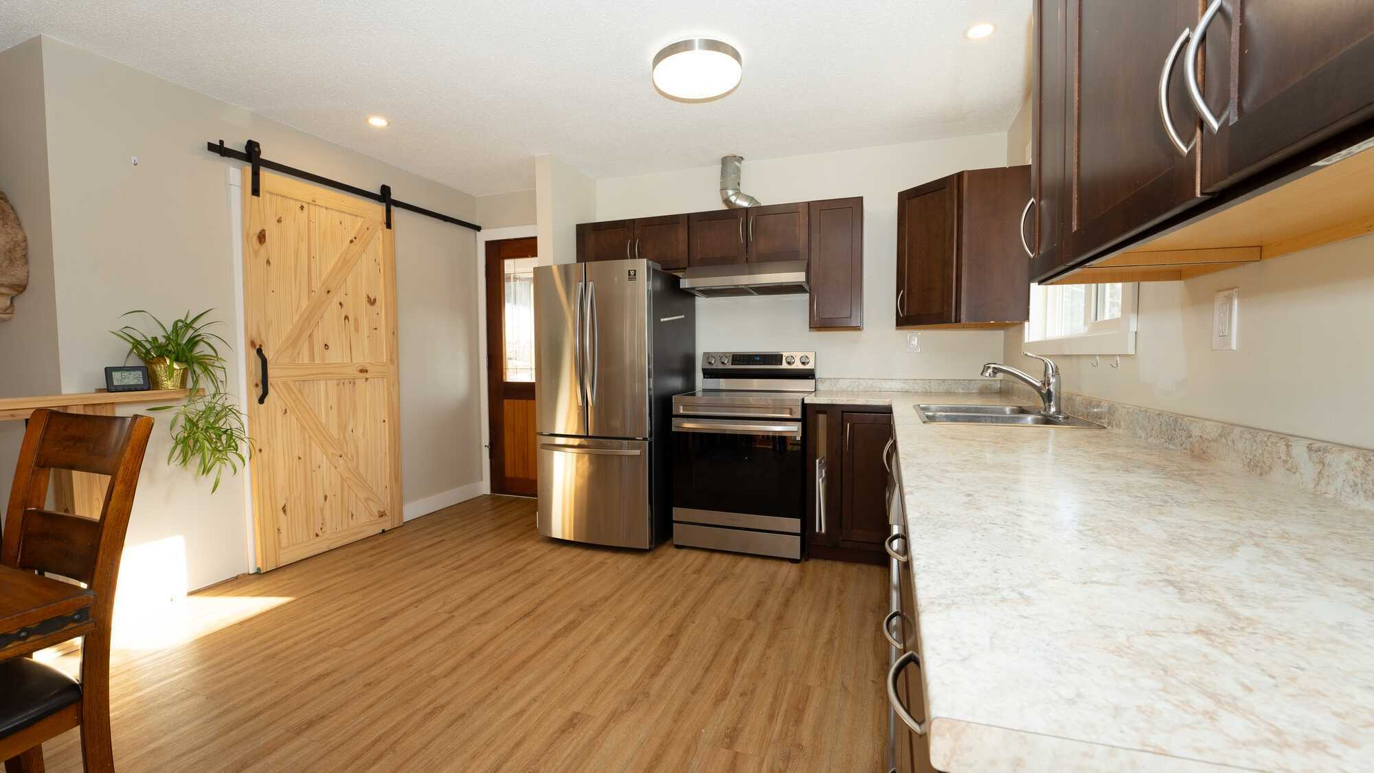 30 acres of countryside, backing onto treed land. 3-bedroom, 2-bathroom house is currently an income property & was fully booked throughout Spring-Fall 2023. Conveniently located near Highway 97B and Highway 1 with quick access to beaches and trails. 5