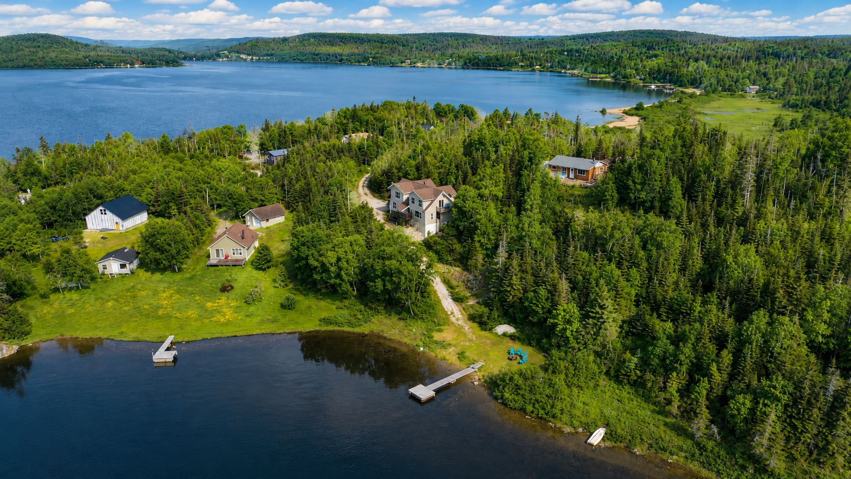 Waterfront living at its finest! This incredible 6 bedroom retreat on 1.25 private acres features two kitchens, two living rooms, a private beach with dock, and endless opportunities for year-round adventure. 4