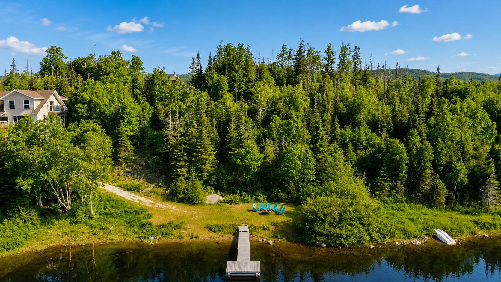 Waterfront living at its finest! This incredible 6 bedroom retreat on 1.25 private acres features two kitchens, two living rooms, a private beach with dock, and endless opportunities for year-round adventure. 3