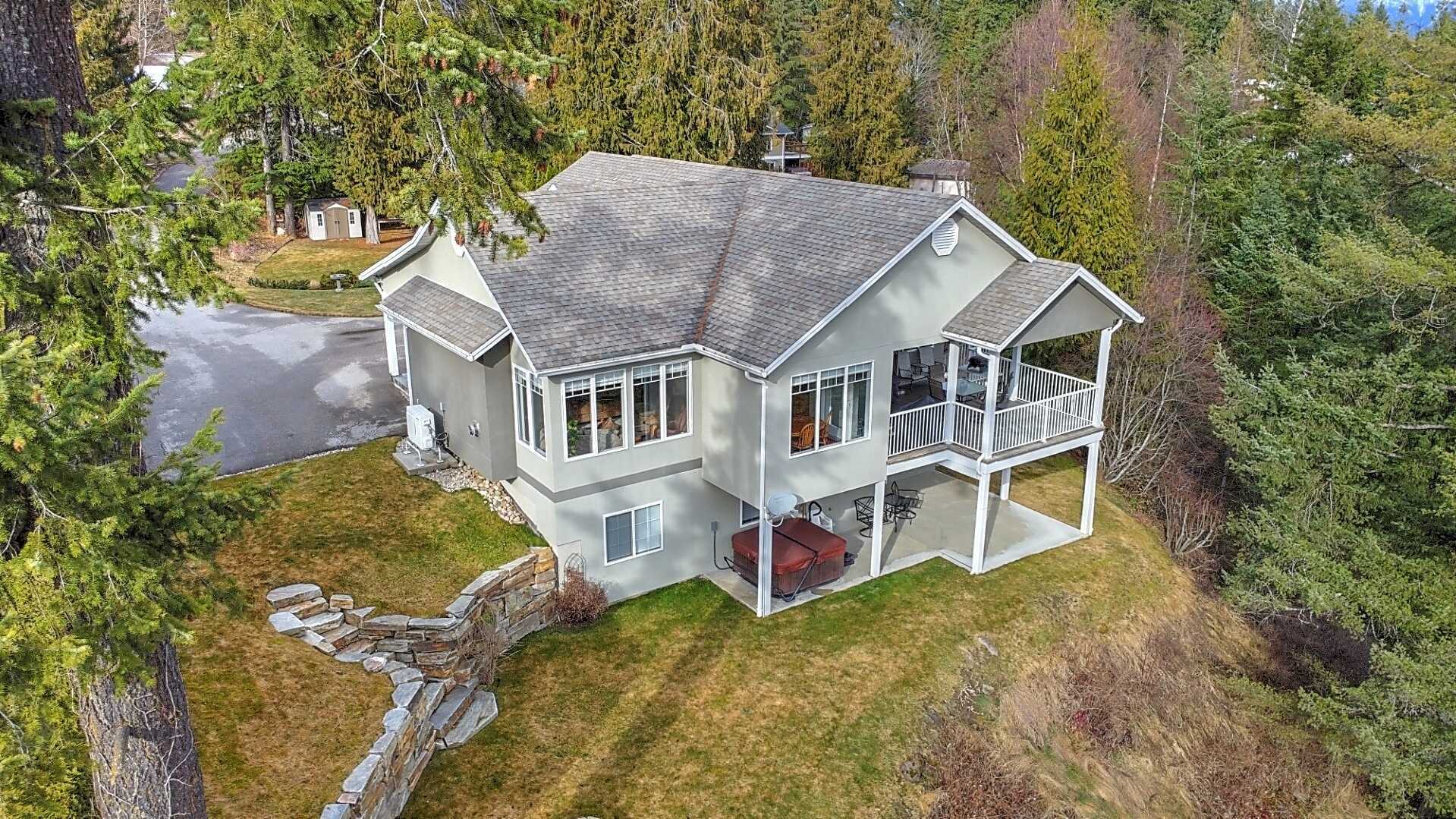 NEW PRICE! KOOTENAY LAKE VIEW. GORGEOUS!! PANORAMIC KOOTENAY LAKE VIEW FAMILY HOME 4BED+ 3BATH! with 2 Bed Suite Potential & a 1 Bed Studio Potential for extra income or Extended Family Living, 1/2 acre of GORGEOUS landscaped property! MUST SEE 2