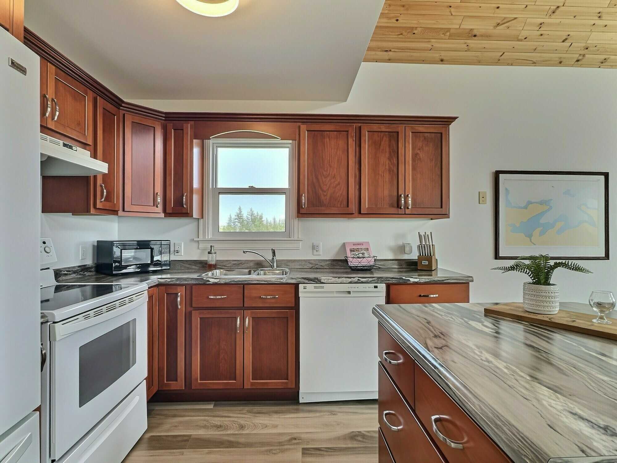 Experience coastal living at its finest with this exceptional executive waterfront estate set on approximately 4 private acres, complete with a secluded beach and breathtaking ocean views! 5