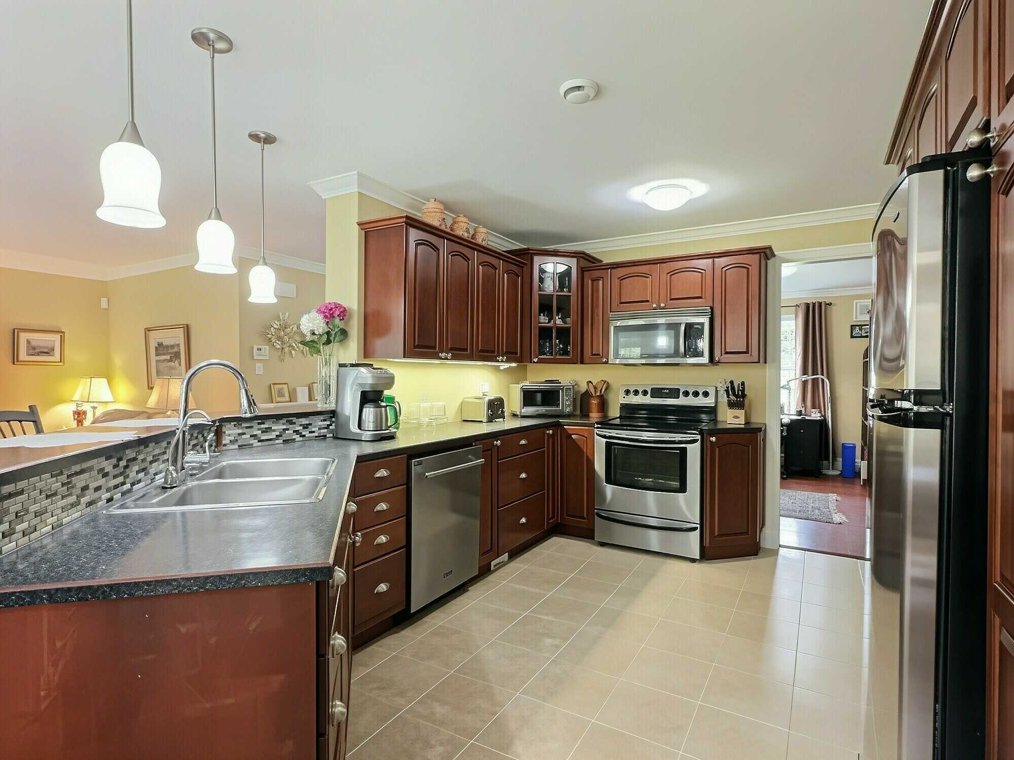 Enjoy easy one-level living on 2.30 private acres backing onto Fox Hollow Golf Course! 4