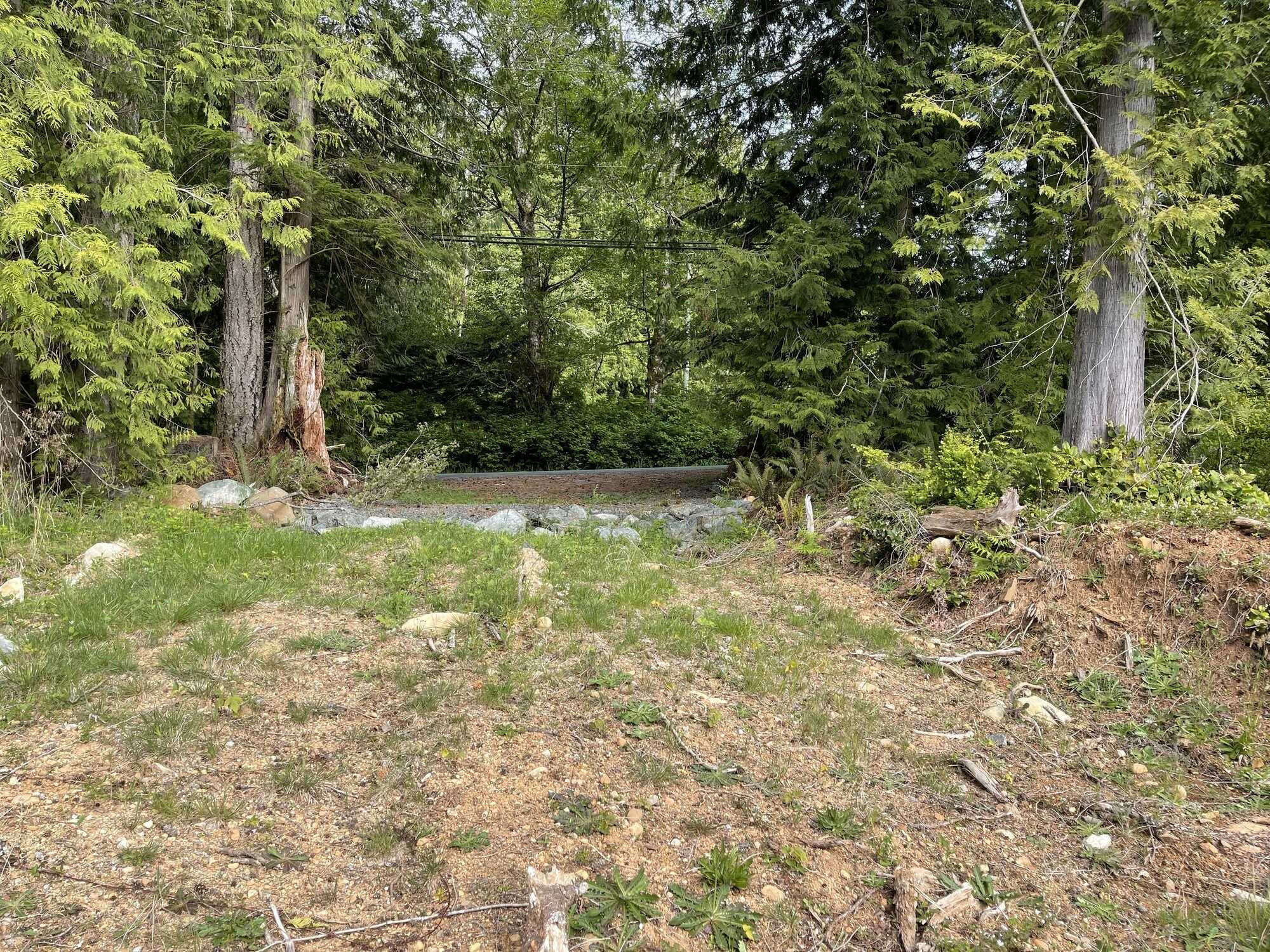 Space to build your dream home - 2,250 sq m of buildable frontage. This rural setting provides space and privacy in a natural setting. On-site well, level building area, zoned RR2 - options for dwelling and land use.  Call 250-919-7126 for info. 4