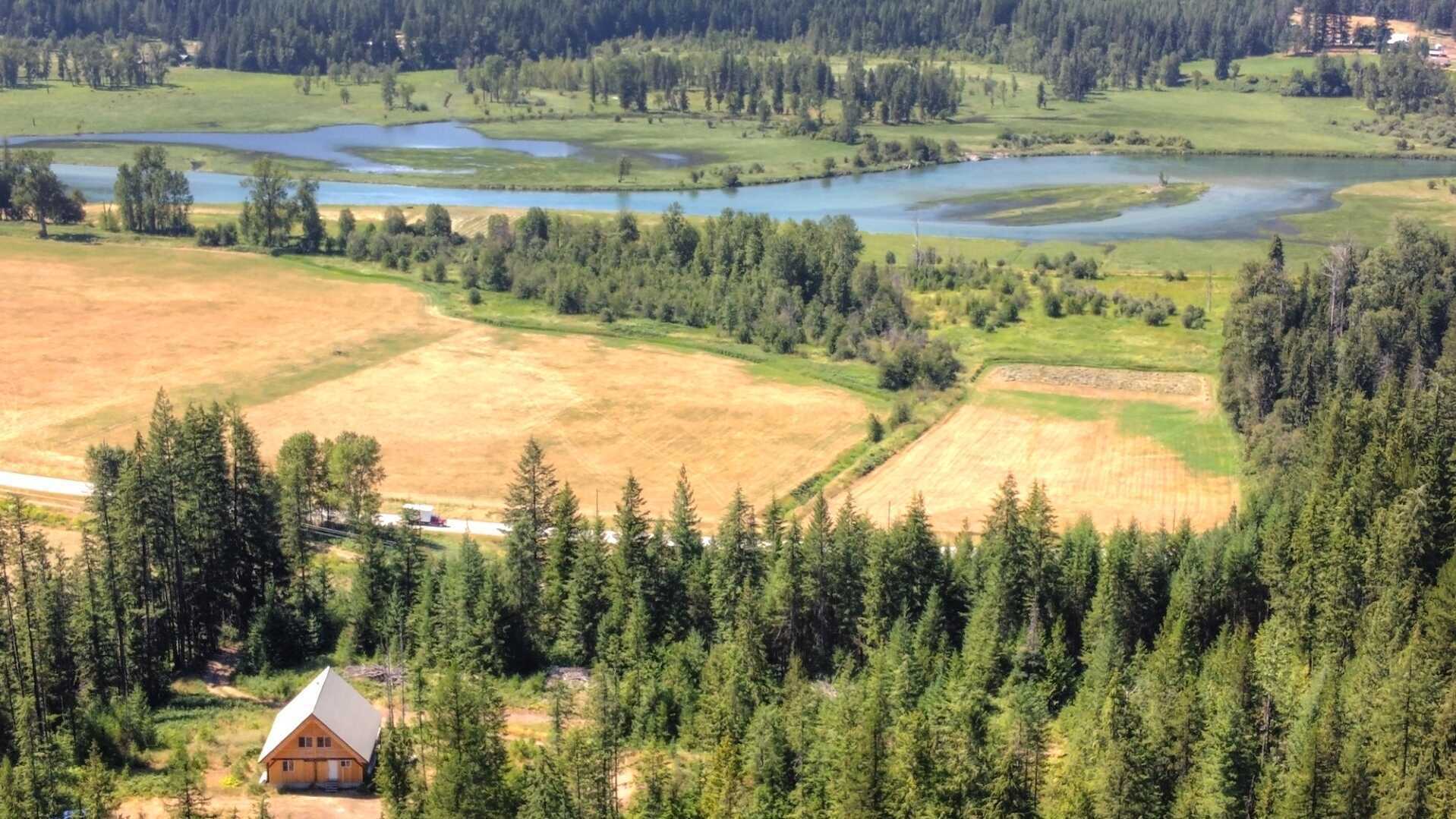 READY & WAITING to be finished 2-3 Bed Country Cottage with views of the Slocan River on 8 ACRES of pure heaven!  Beneath the Slocan Valley skies, this home is paradise! 3