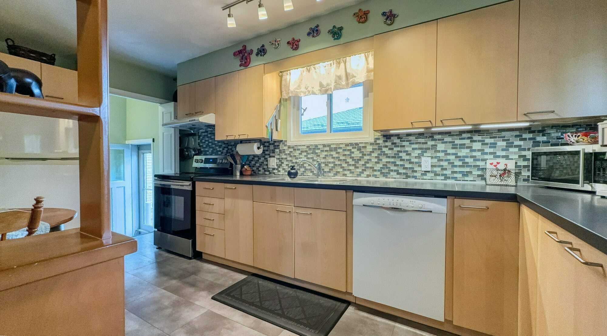 Centrally Located Bungalow with attached garage! 2