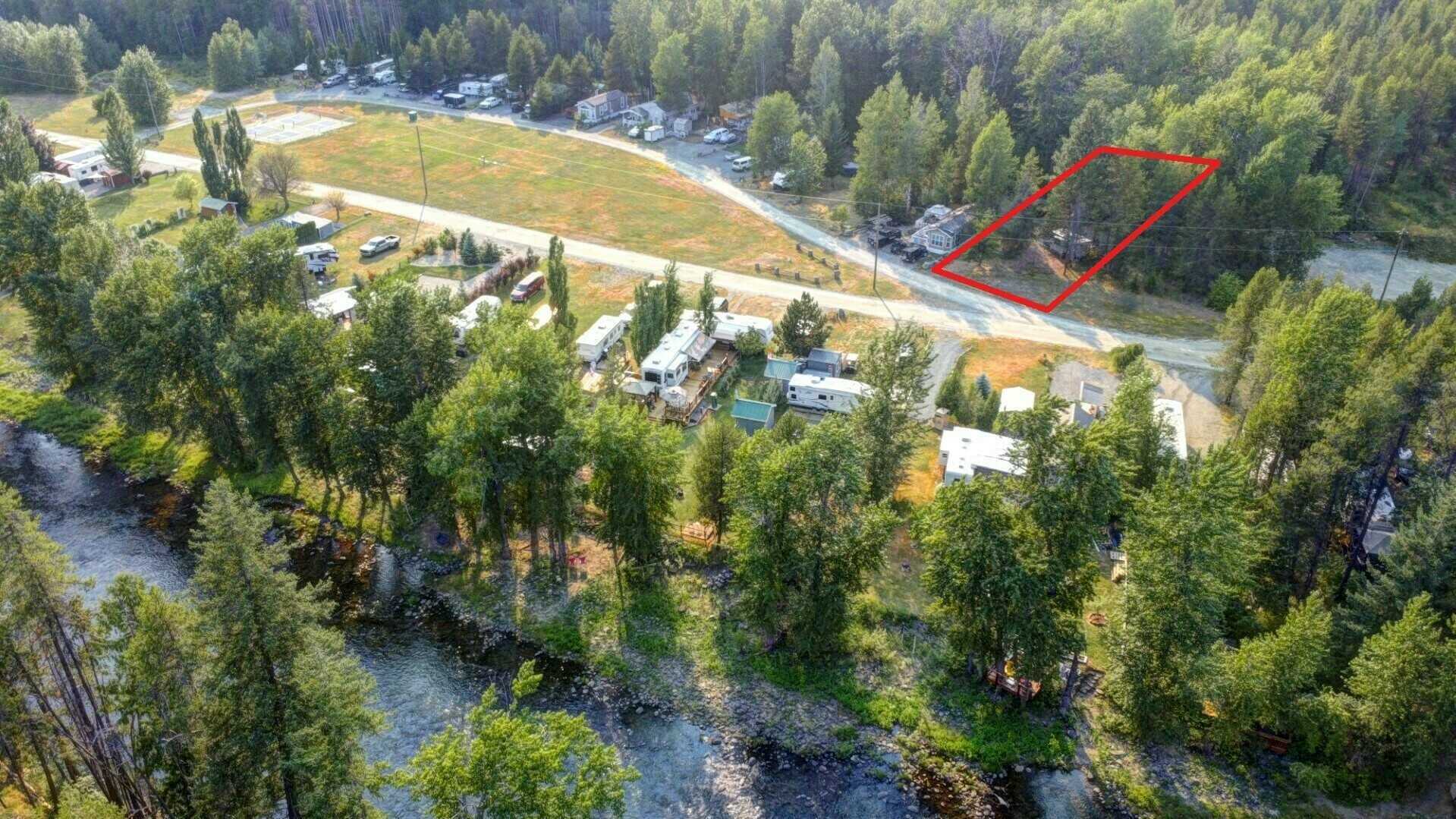 #2 Mountain Ridge Rd  - 3 Season MOYIE RIVER RANCH RESORT – Secluded, treed lot c/w RV! Steps to the Moyie River in a fabulous community! Ask about purchasing just the LOT at a Reduced Price!!! 5