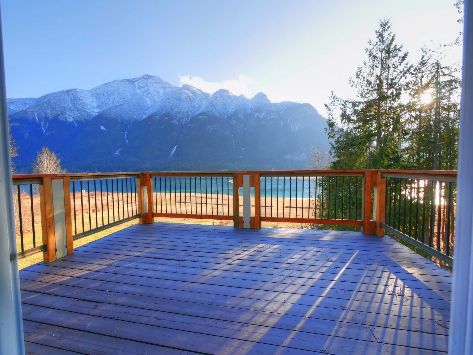 SPECTACULAR LAKE & MOUNTAIN VIEWS AT THE DOOR STEP! 3Bed 1.5Bath Lakehouse! 300ft of Waterfront! Beautiful Deck! Balcony! Over 3Acres of absolute privacy & beautifully landscaped! Private beach! Boat Launch access 4