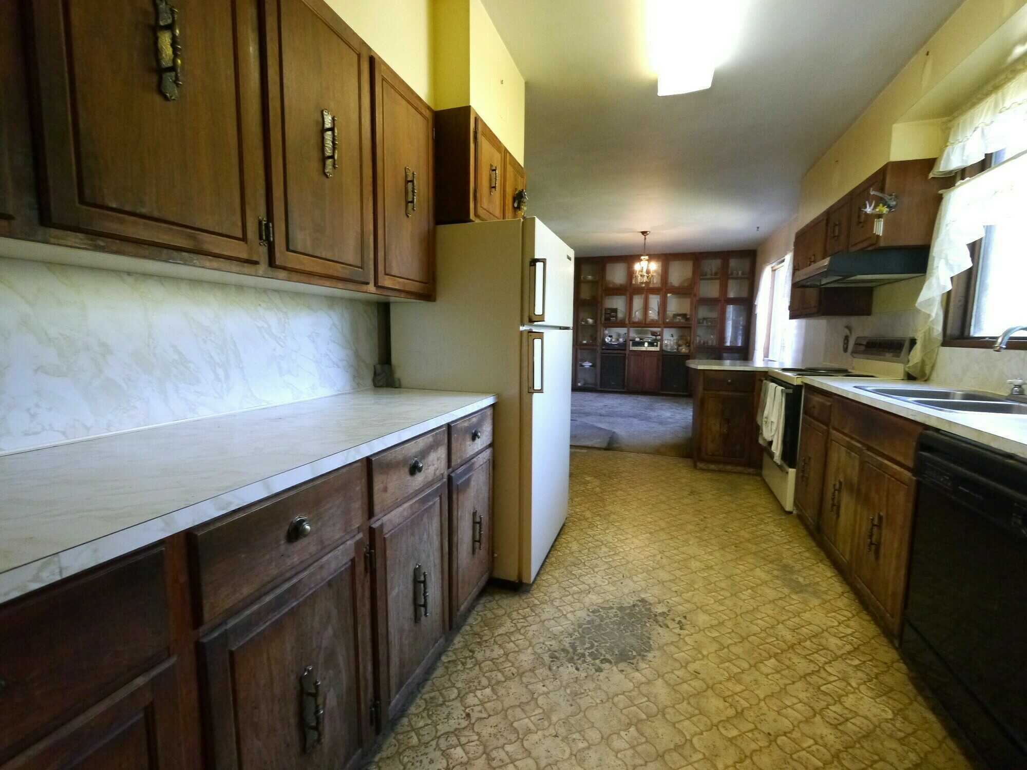 POTENTIAL DEVELOPMENT!  PROJECT PROPERTY!  4Bed 1Bath home looking for love from someone who loves a challenge!  2 Titles and 0.5 acres approximately with a large outbuilding on a No Thru Road! 3