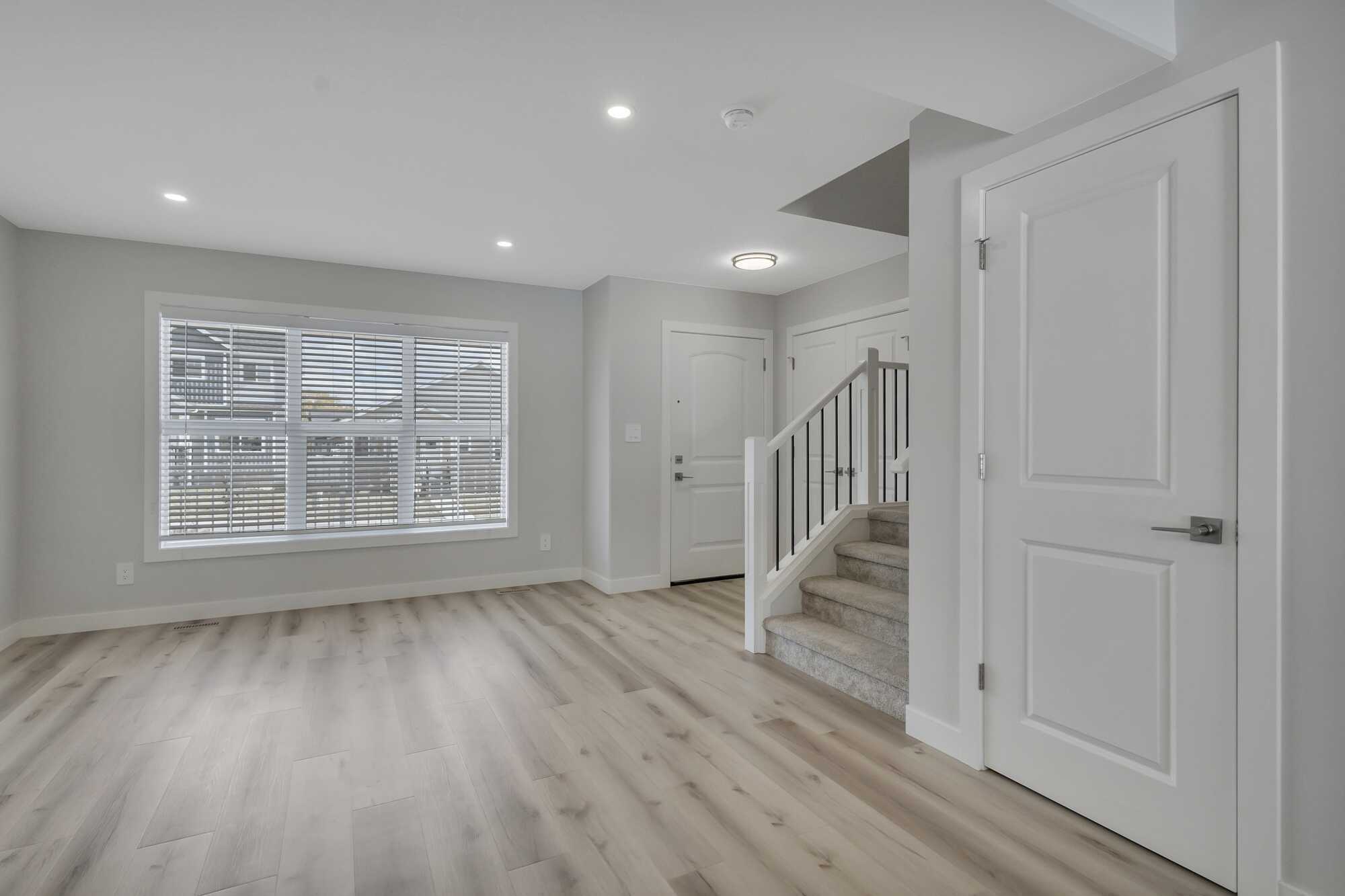 Newer (2025) ~ Bright 2 Story ~ 1/2 Duplex ~ Backs Onto Field ~ Great Location ~ Sylvan Lake 4