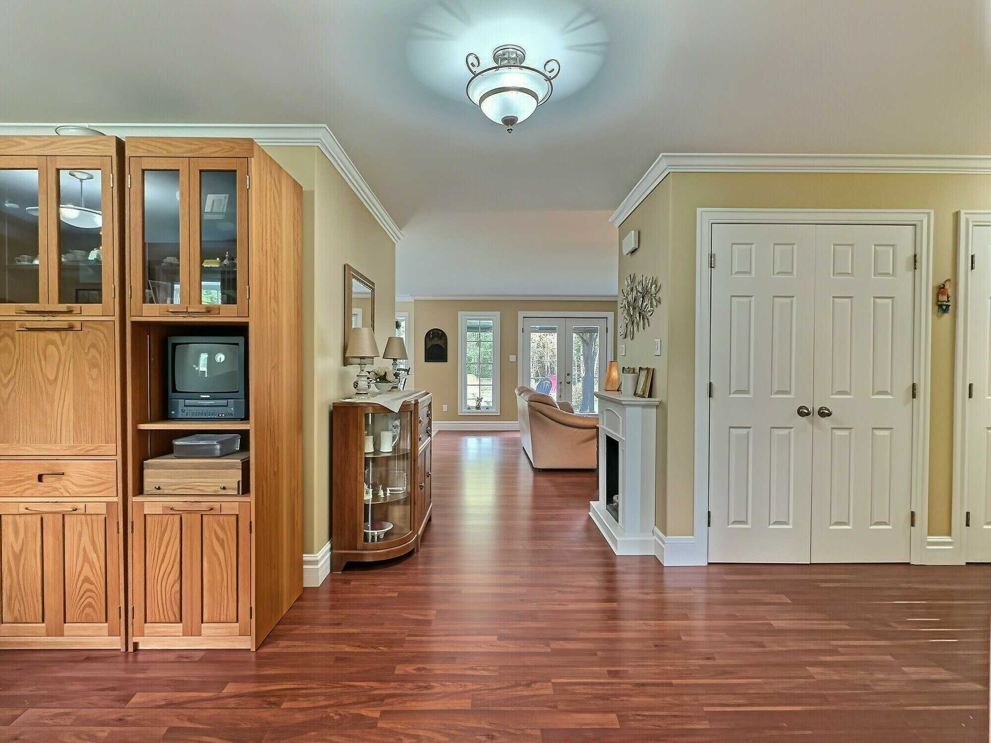 Enjoy easy one-level living on 2.30 private acres backing onto Fox Hollow Golf Course! 2