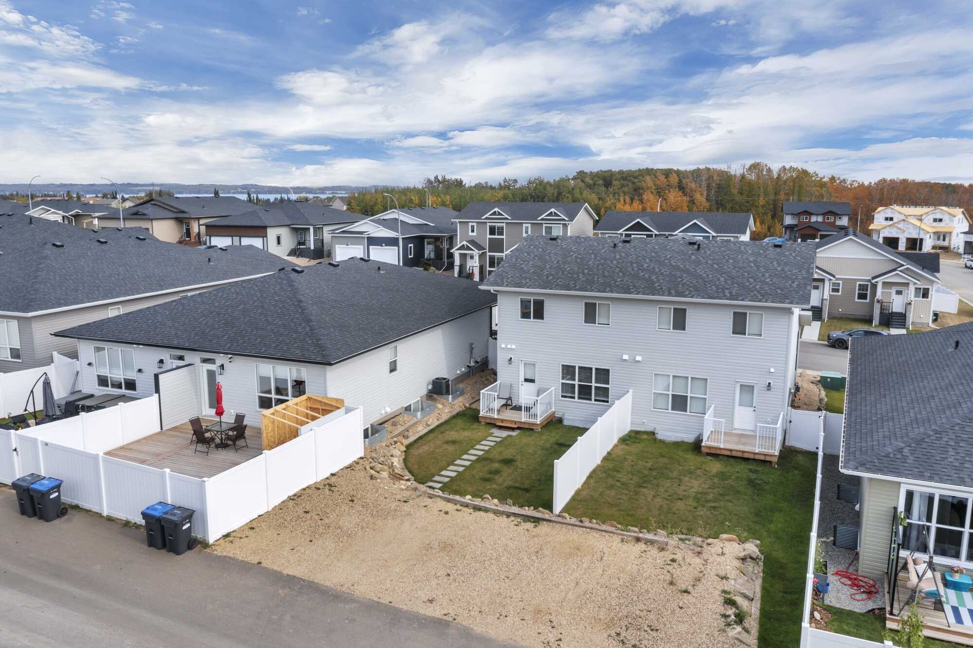 Newer (2025) ~ Bright 2 Story ~ 1/2 Duplex ~ Backs Onto Field ~ Great Location ~ Sylvan Lake 2