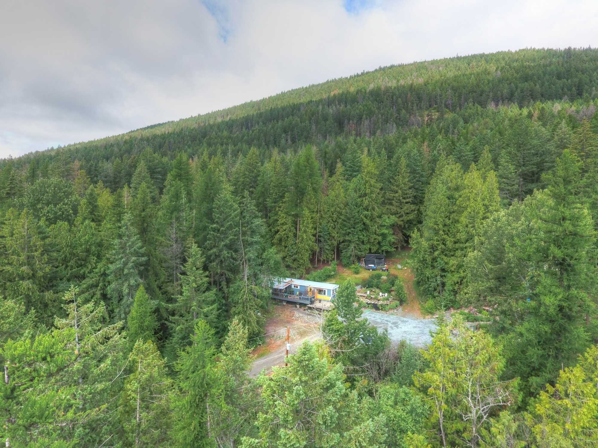 DIRECT CONTACT @  250-977-5898  * OFFERING $12,000 COMMISSION!!!!  Amazing Acreage! Nearly 10 Acres – Benched w/ Timber! 2Bed 1Bath Mobile home w/ Addition & 2 Level Deck! Landscaped! Opportunity to build your DREAM VIEW HOME! 2