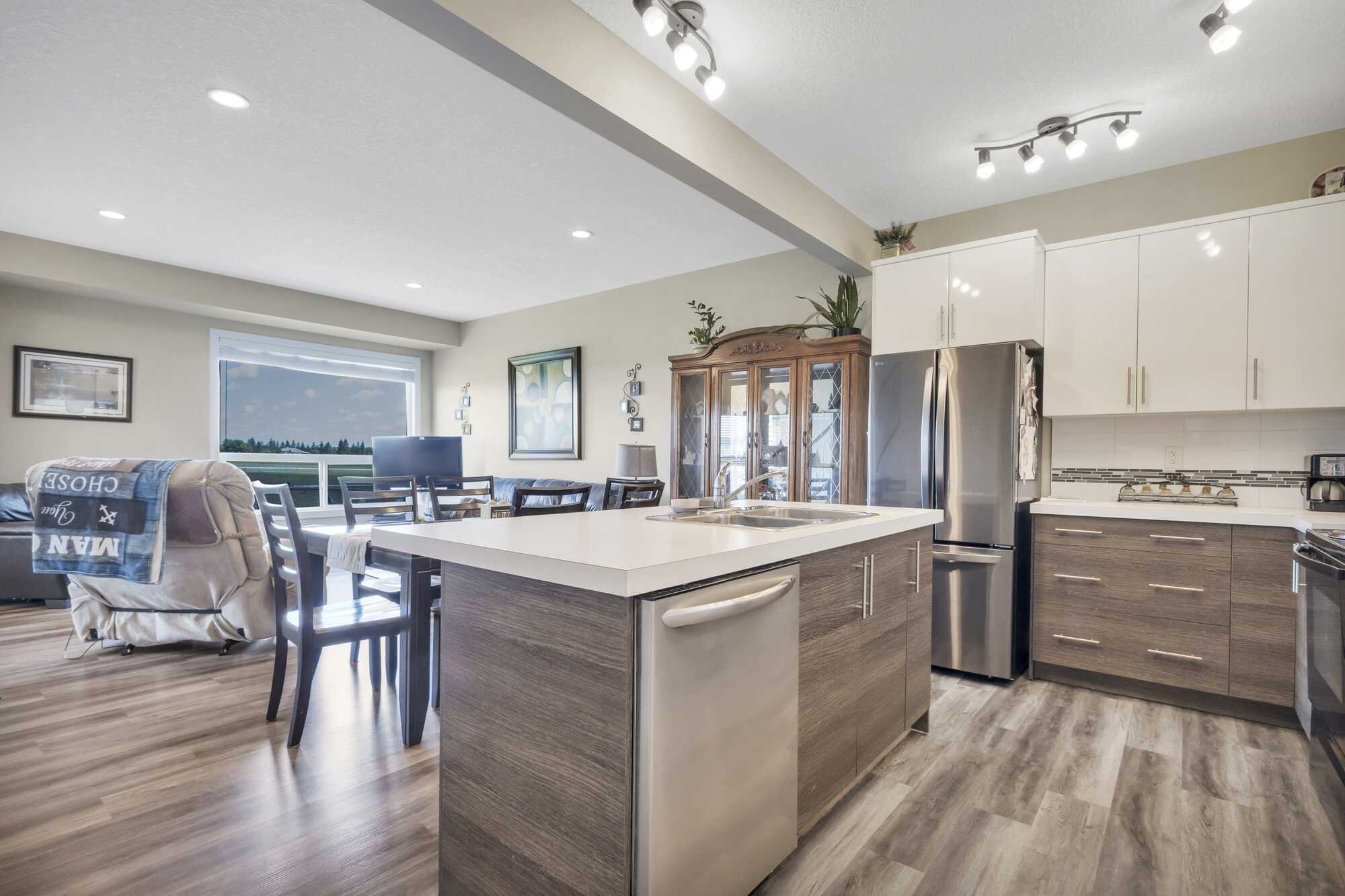 Immaculate & Affordable 2 Story Home ~ Single Attached Garage ~ Condo ~ No Yard Work ~ Backing Onto Green Space ~ In Lacombe 5