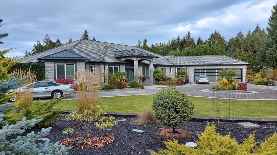 Just Listed ! This Stunning 5,492 sq.ft modern custom-built 4 beds 4 bath home could be yours ! Includes a 1200 sq.ft. attached 2 bed 2 bath Addition on close to 3 acres of property with a beautiful orchard by Englishman River ! 3