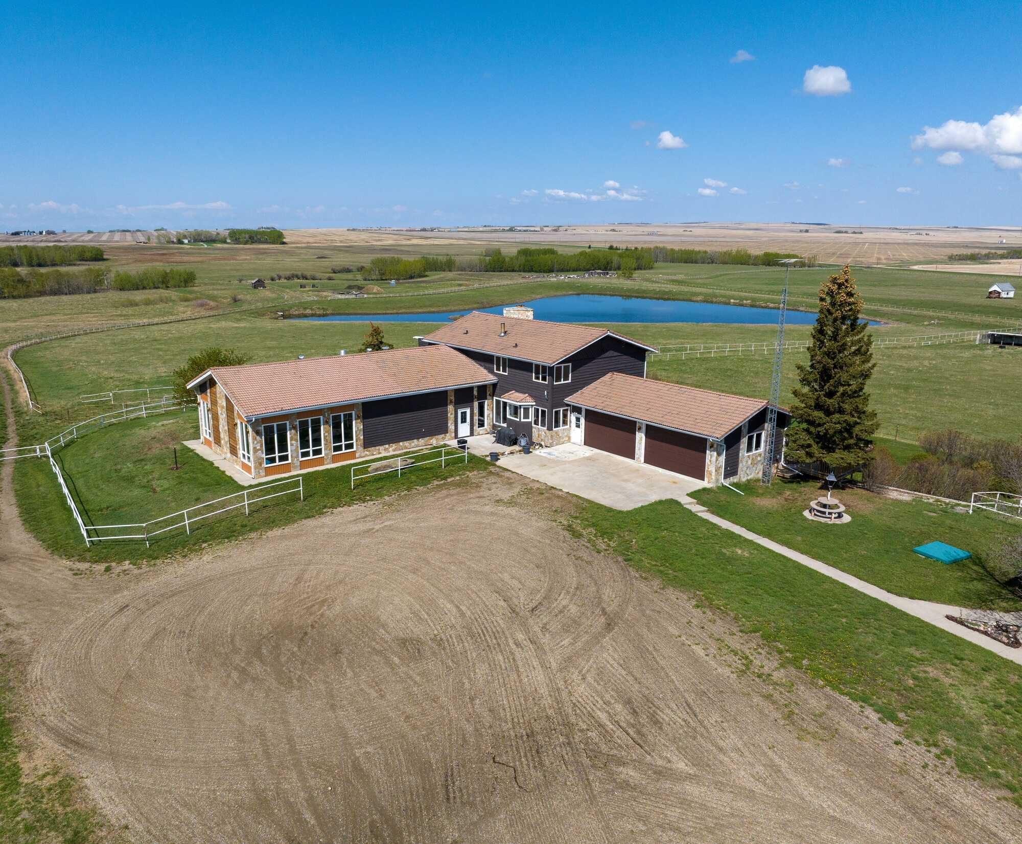 Full quarter section of luxury living, equestrian facilities, and natural beauty! 2
