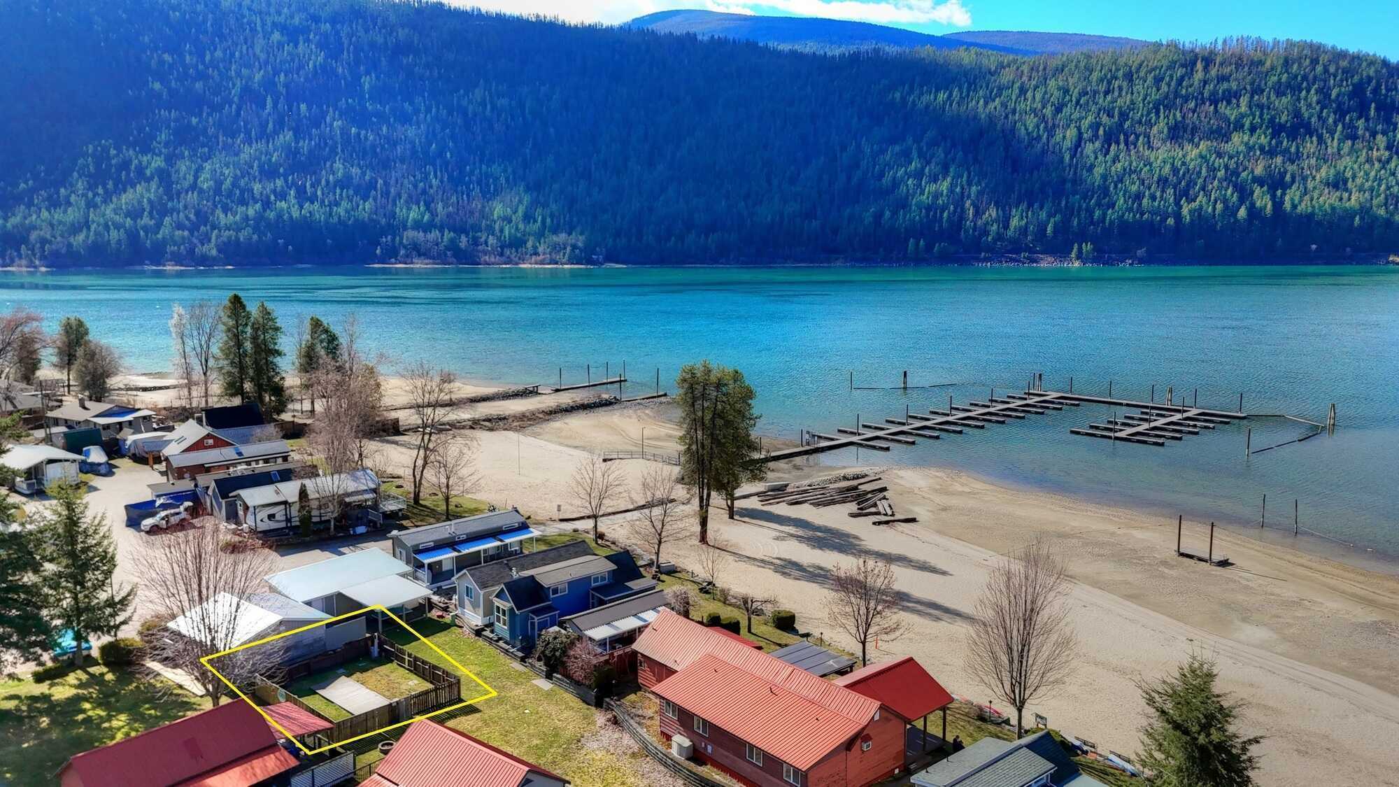 Next to Kootenay Lake!  VACATION PROPERTY - LARGE LOT! NEW MARINA BY 2026 Private and ideal for the summer getaways! Hookups for RV or TINY HOME or put in a MODULAR HOME! 4